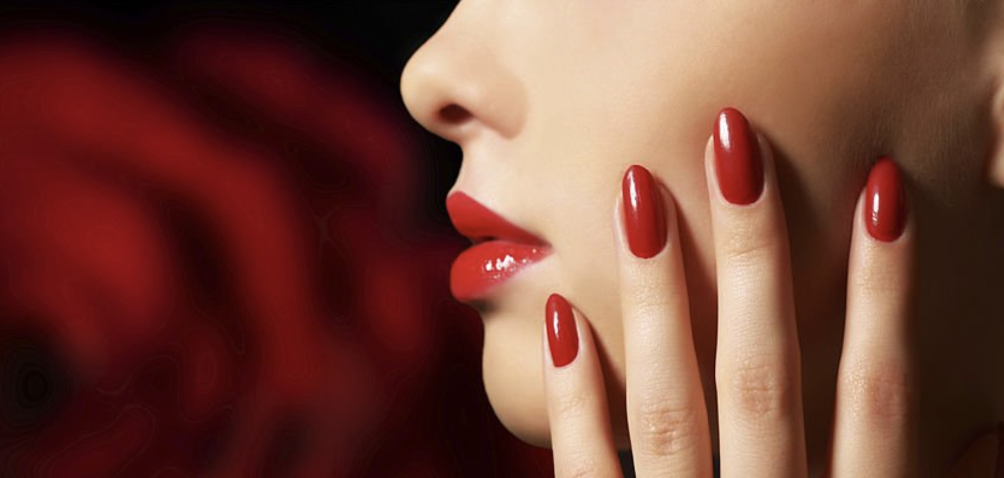 image of red nail polish on beautiful nails